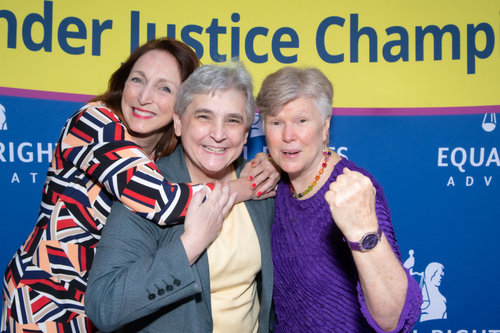 image of ERA executive director Noreen Farrell, Kristen Galles, and Board member Dale Schroedel smiling together. The blue background contains ERA's logo, with a yellow header that says 