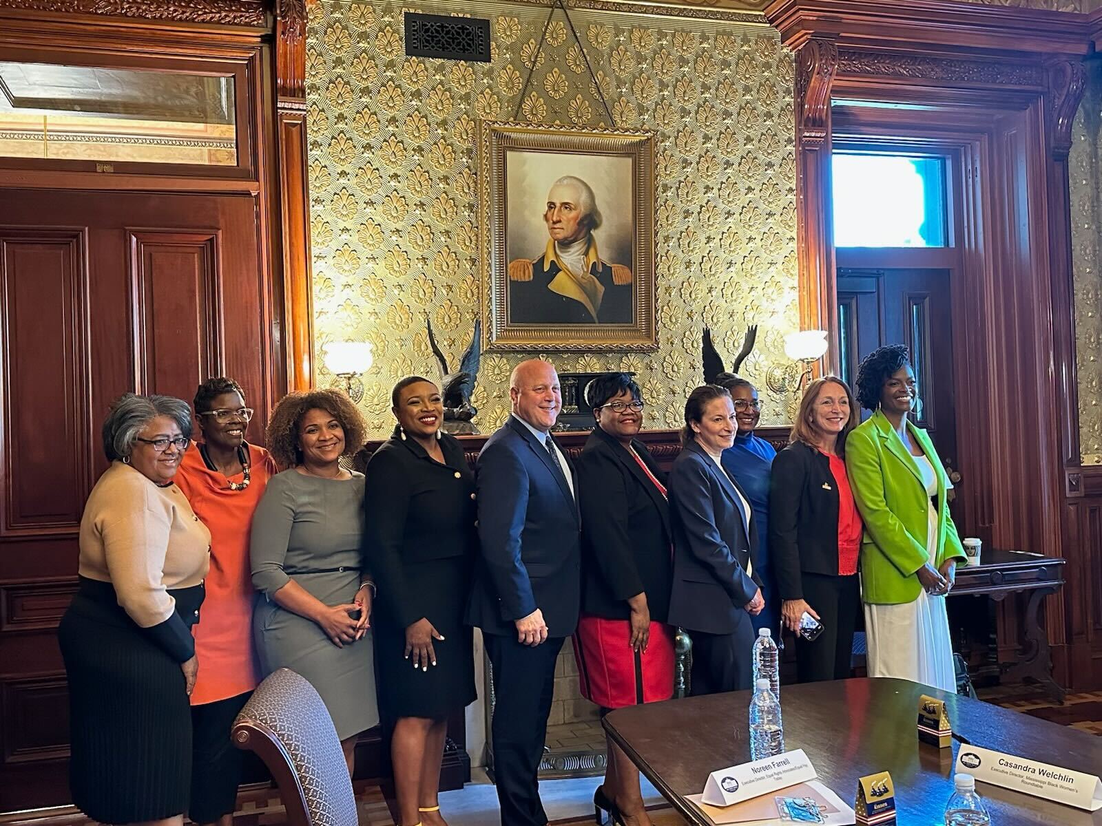 A group of Advocates and Biden Administration staff at the White House discussing economic justice for Black women